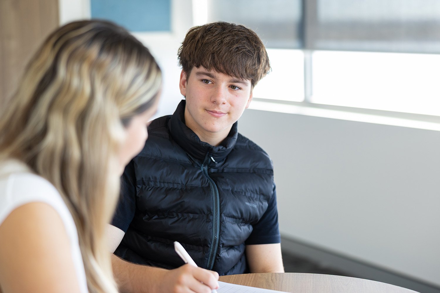 Occupational Therapist providing handwriting for a teenage boy