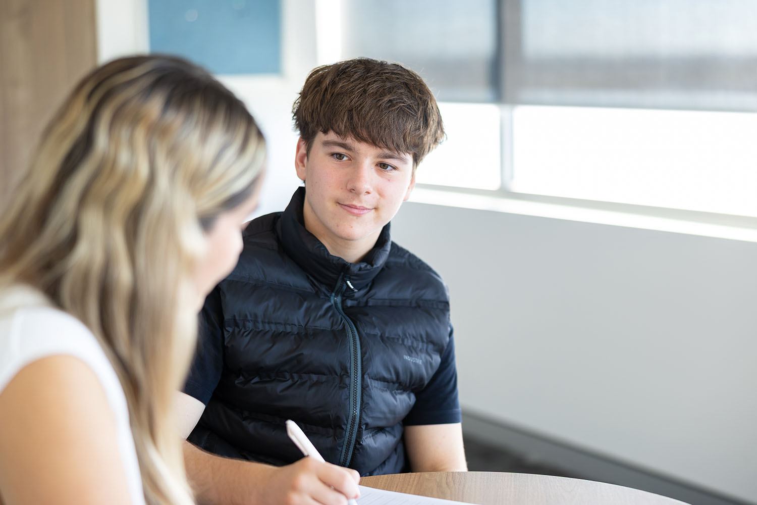 Occupational Therapist providing handwriting for a teenage boy