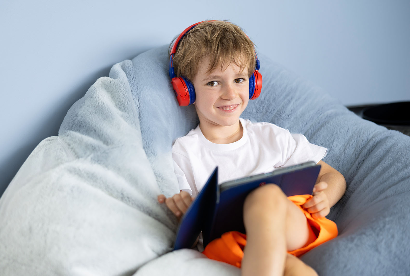 Young Boy on iPad with Headphones
